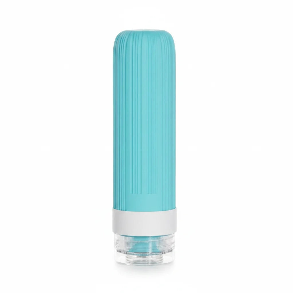 Teal Vertical Ribbed Silicone Travel Squeeze Bottle with Silver Collar and Clear Screw-On Base Cap on white background