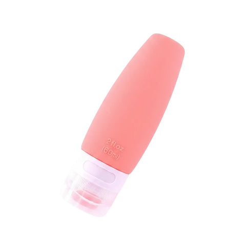 imgi_4_Coral_pink_silicone_travel_bottle_60ml_at_45_degree_angle_showing_smooth_body_and_clear_bottom_screw_cap_on_white_backgr