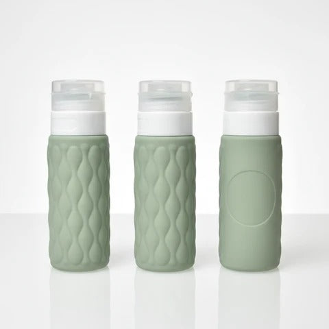 imgi_6_Three_sage_green_diamond_textured_silicone_travel_bottles_showing_front_side_and_back_angles_on_white_background_lar